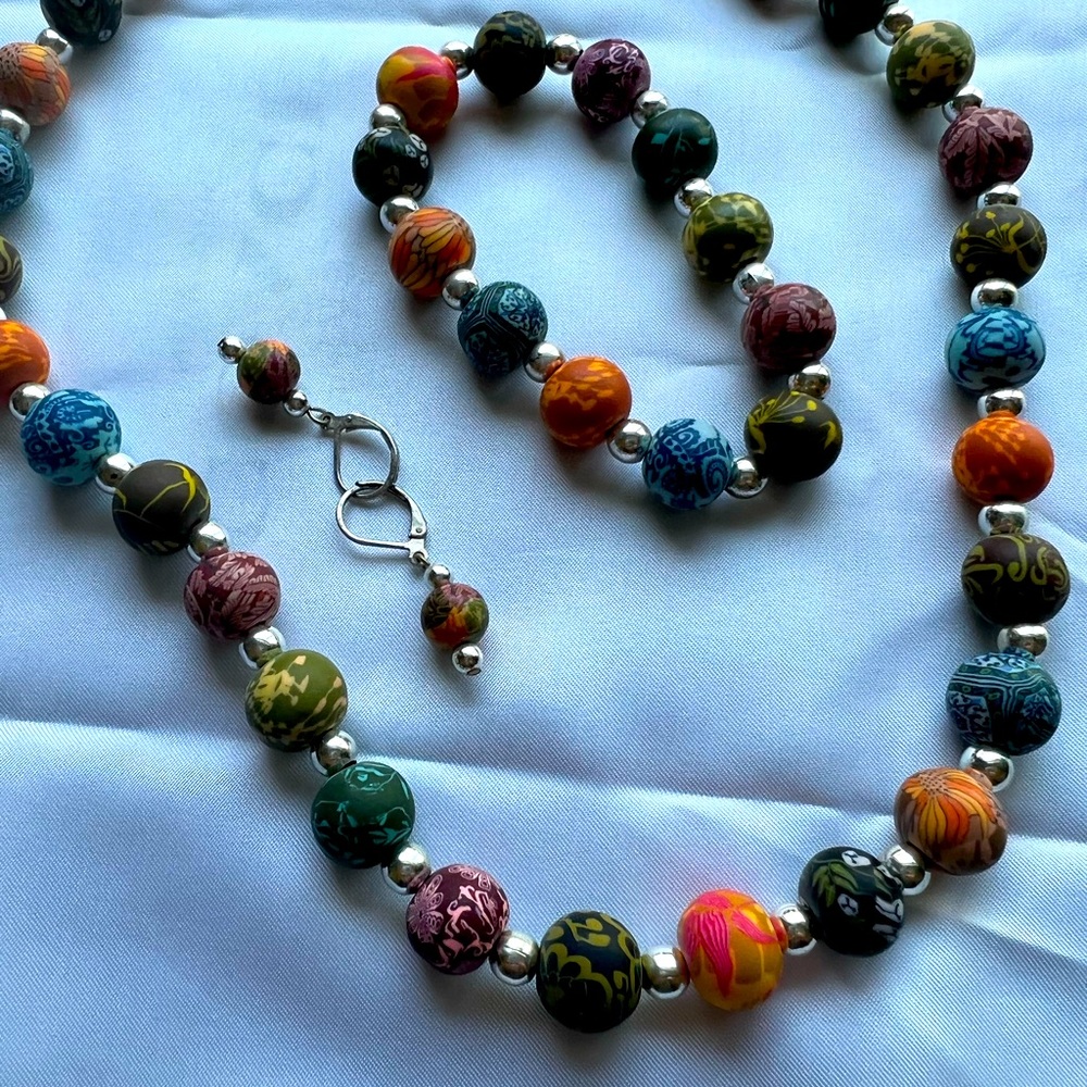 Multi colored beaded necklace, bracelet and earrings